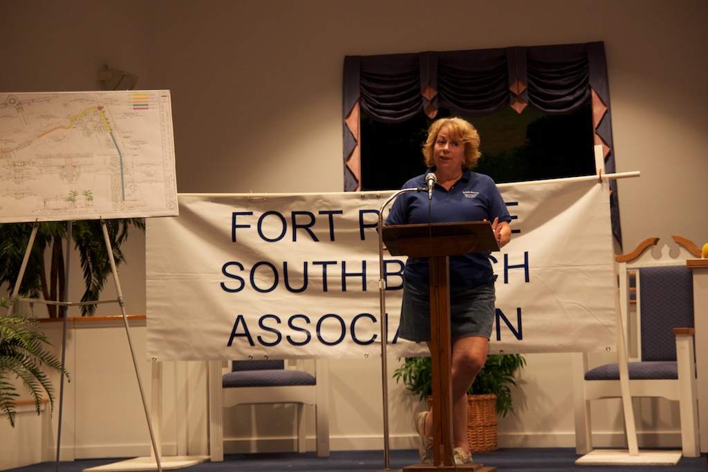 Christine Coke prepares to present the Islander Award to Mayor Bob Benton